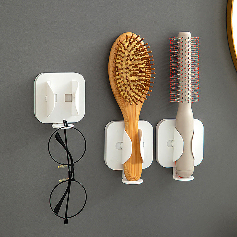 Wall-mounted gravity-sensor electric toothbrush holder, no drilling required, multi-functional toothpaste and comb holder for bathroom use.